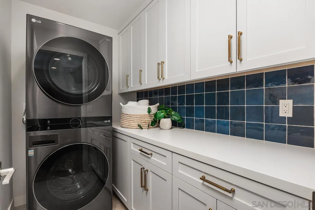 559 North Vulcan Avenue Encinitas, CA 92024 - Photo 35 of 50 a close view of a sink and dishwasher in a kitchen