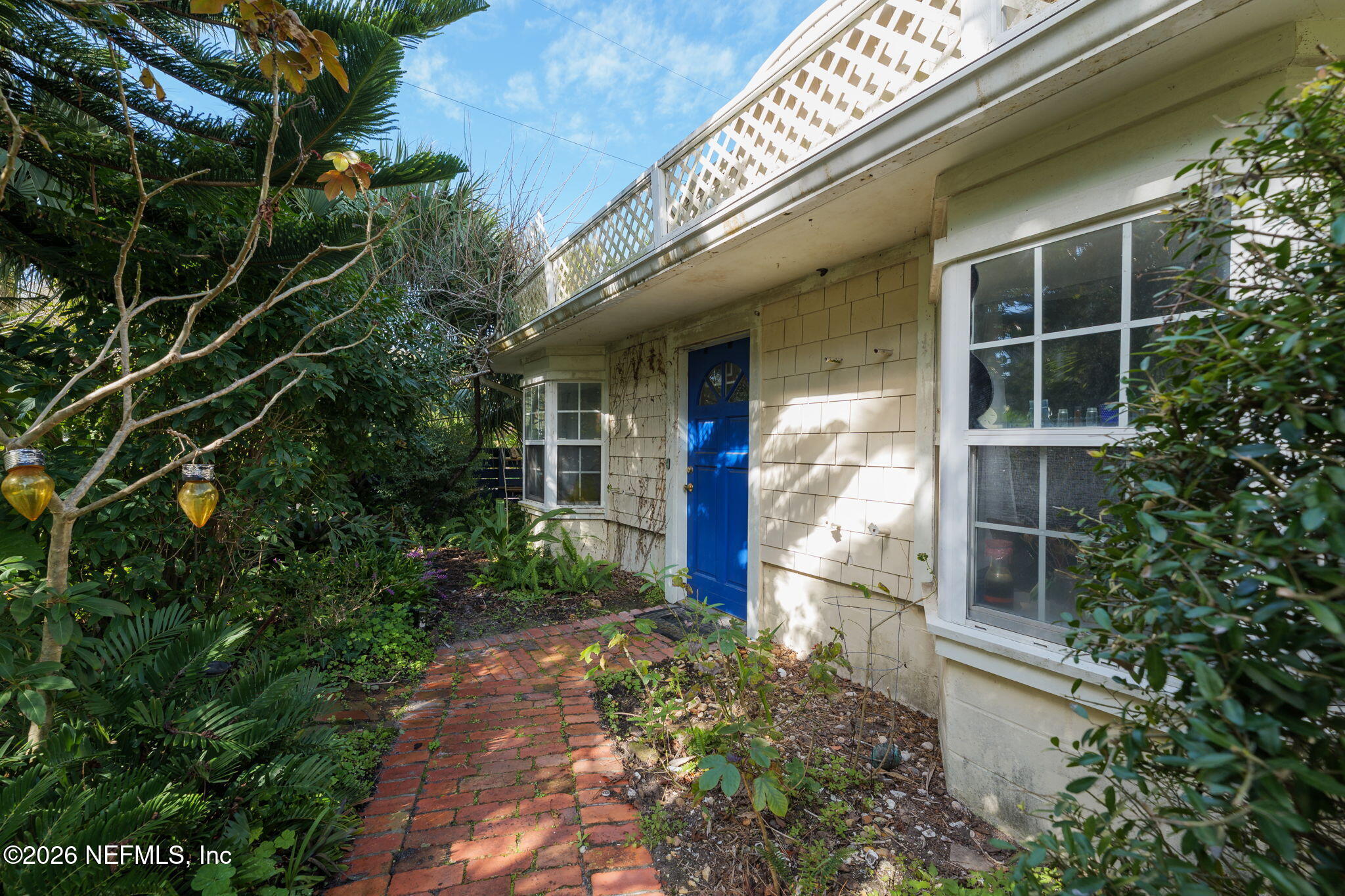211 Beach Avenue Atlantic Beach, FL 32233 - Photo 14 of 44 a view of the house with plants and trees