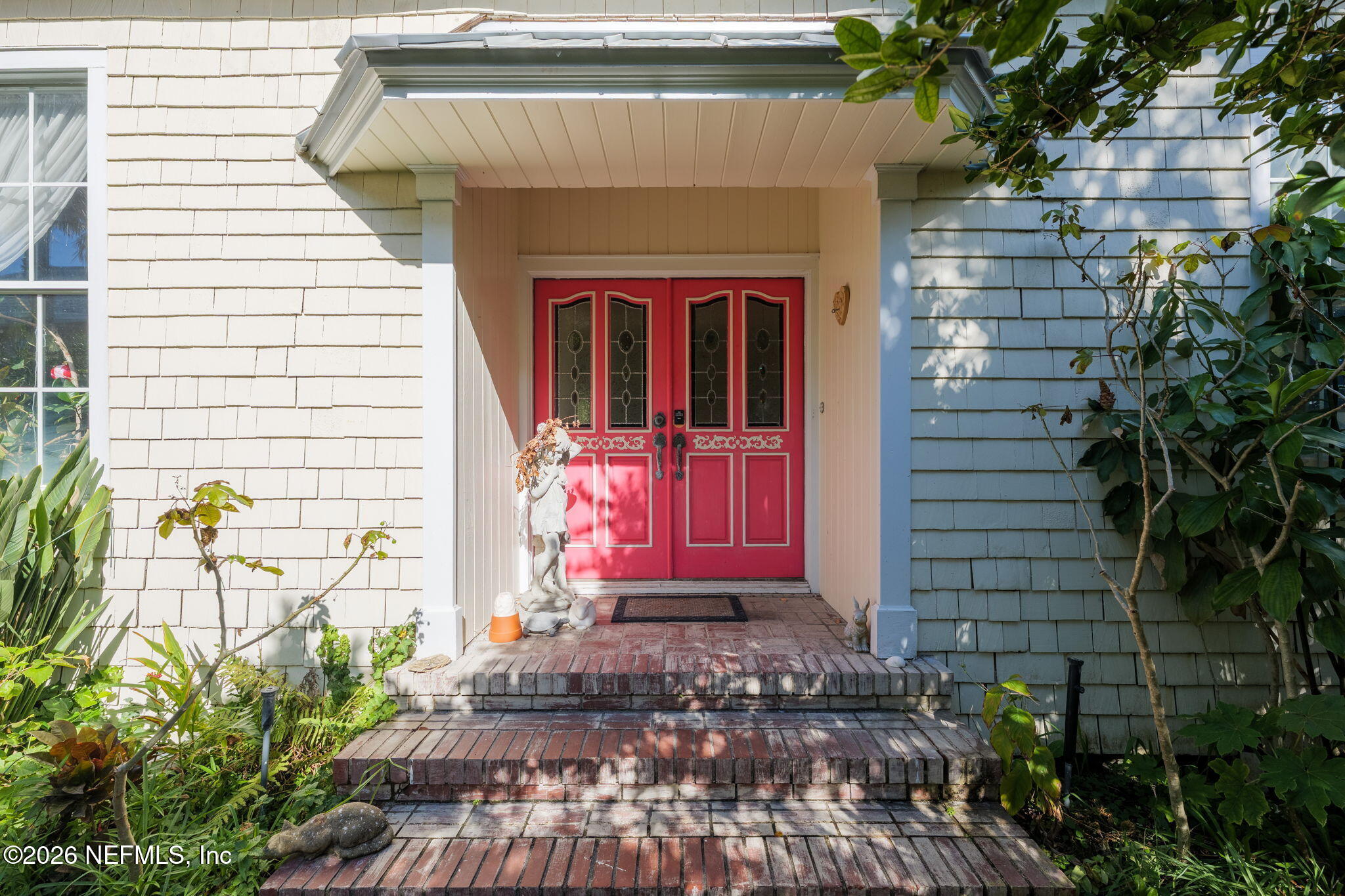 211 Beach Avenue Atlantic Beach, FL 32233 - Photo 23 of 44 a front view of a house with a yard