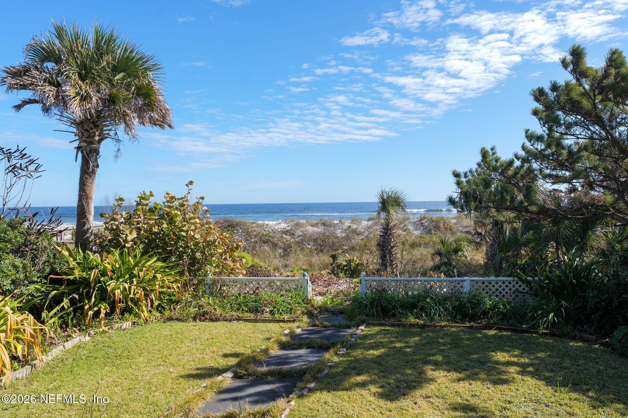 211 Beach Avenue Atlantic Beach, FL 32233 - Photo 27 of 44 a view of a lake with a yard