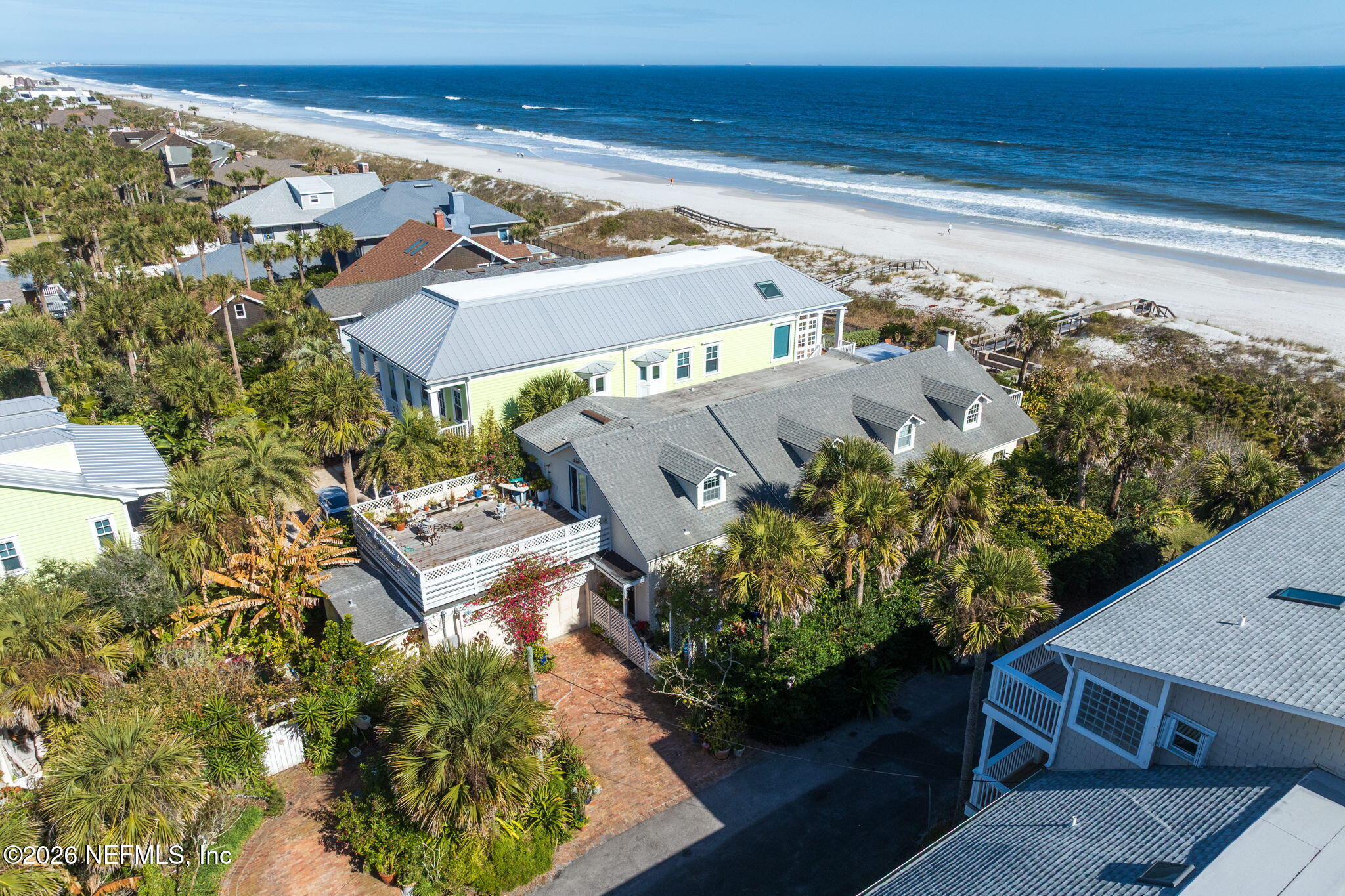 211 Beach Avenue Atlantic Beach, FL 32233 - Photo 3 of 44 view of a balcony with chairs and a potted plant