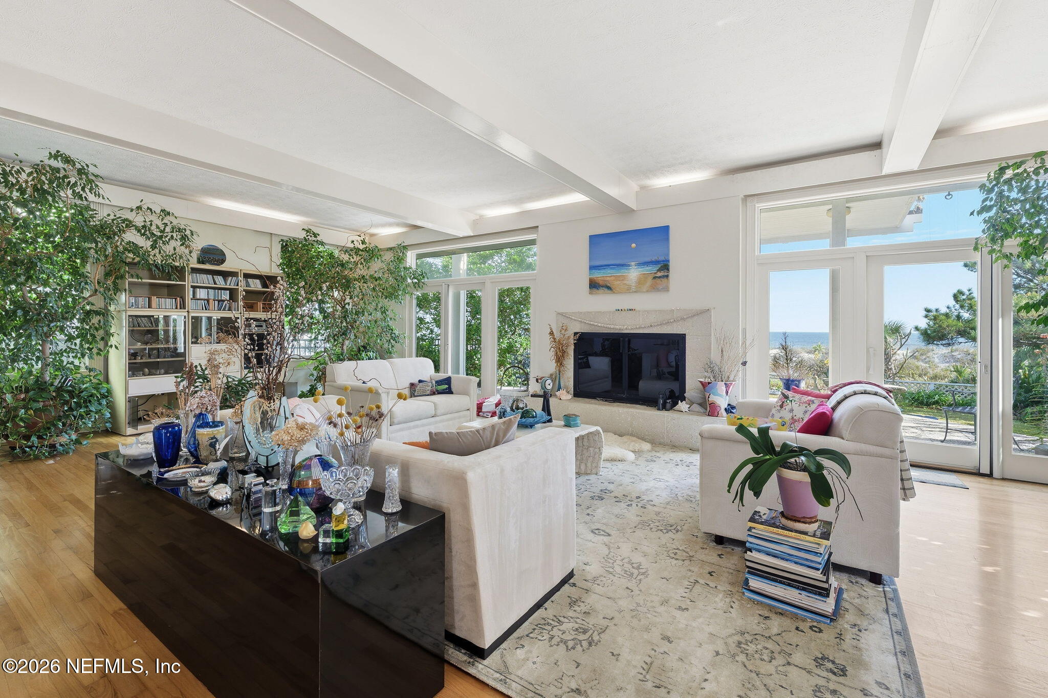 211 Beach Avenue Atlantic Beach, FL 32233 - Photo 31 of 44 a living room with furniture fireplace and a large window