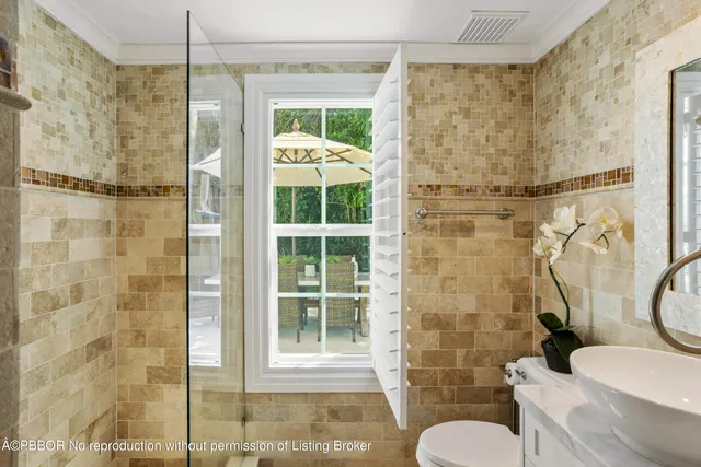 a bathroom with a shower and a toilet