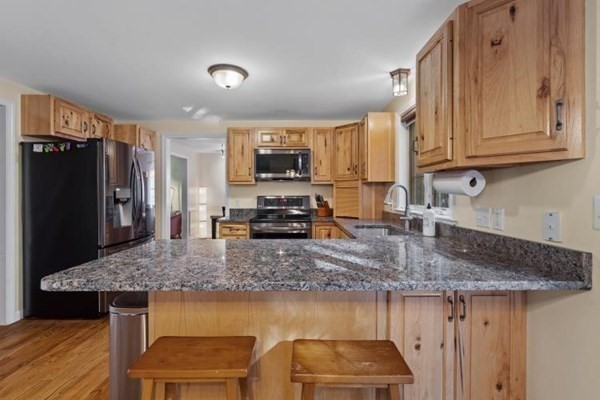 42 Fairview Park Road Sturbridge, MA 01566 - Photo 15 of 41 a kitchen with stainless steel appliances granite countertop a sink stove and refrigerator