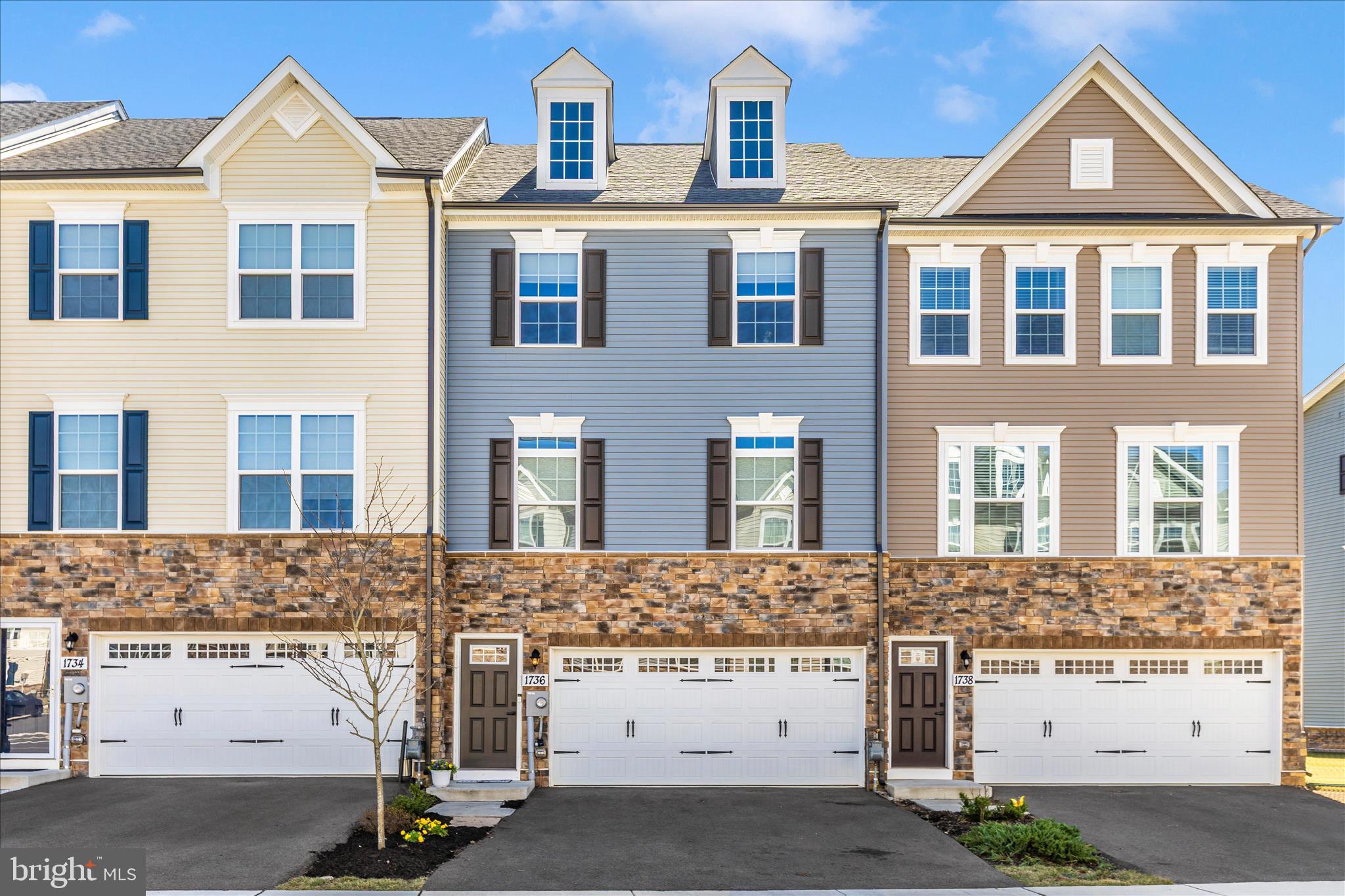 1736 Atlas Drive Frederick, MD 21702 - Photo 52 of 99 a front view of a house with a yard