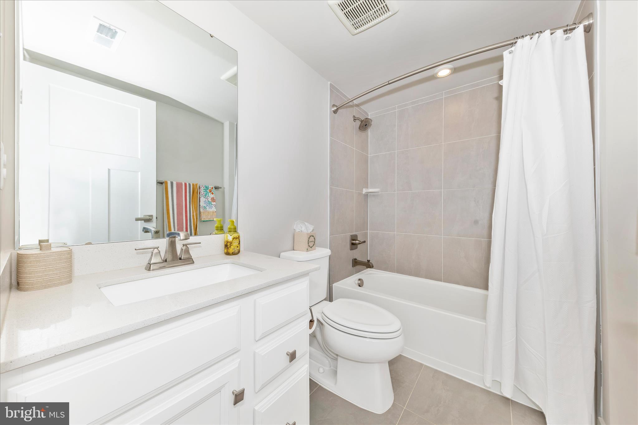 1736 Atlas Drive Frederick, MD 21702 - Photo 57 of 99 a bathroom with a granite countertop sink toilet and shower