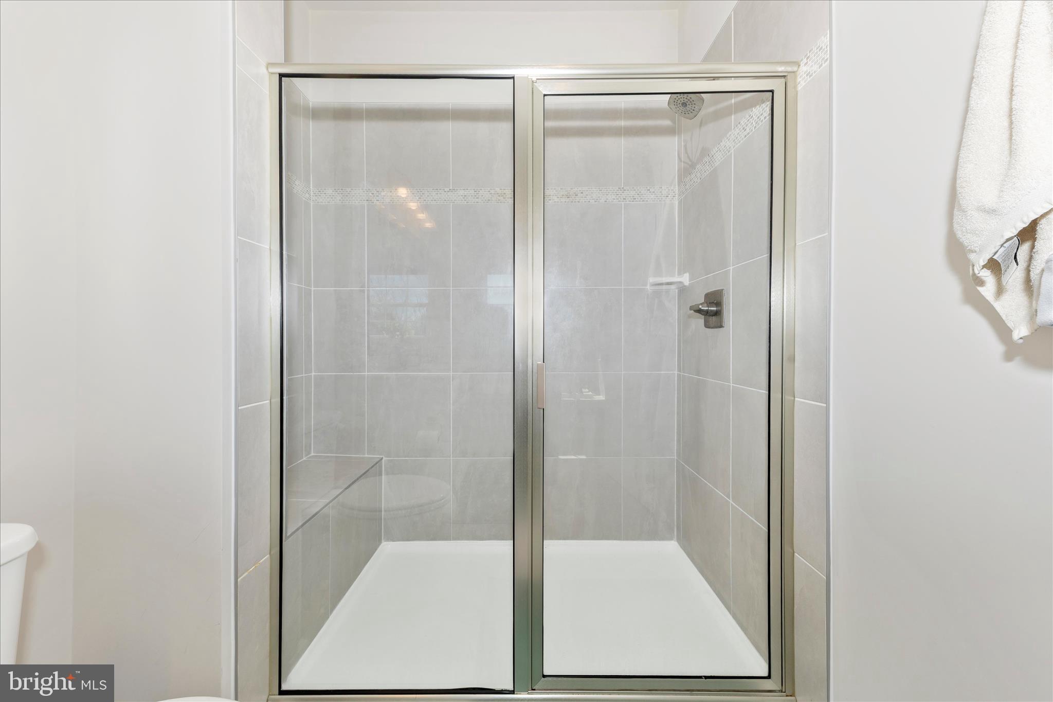 1736 Atlas Drive Frederick, MD 21702 - Photo 80 of 99 a bathroom with a glass shower door