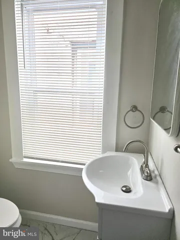 a bathroom with a sink and a toilet