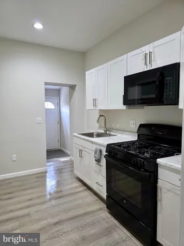 a kitchen with a stove and a microwave