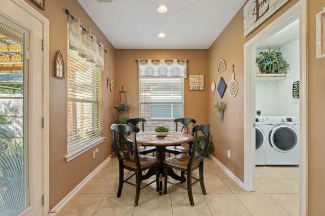 a dining room with furniture and window
