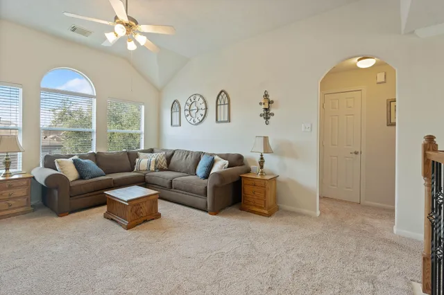 a living room with furniture and a large window