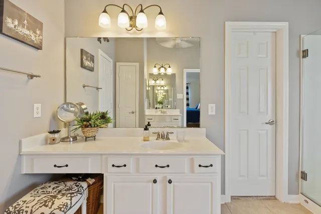 a bathroom with a double vanity sink and a mirror