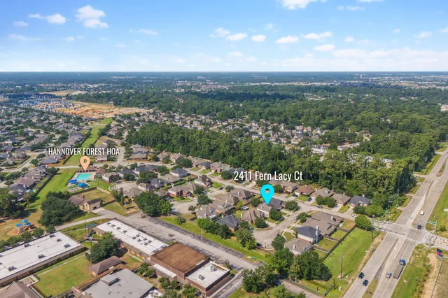 an aerial view of a city with lots of residential buildings