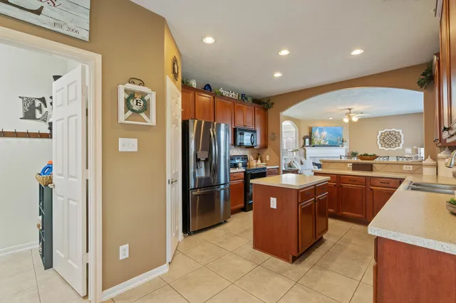 a kitchen with cabinets and stainless steel appliances