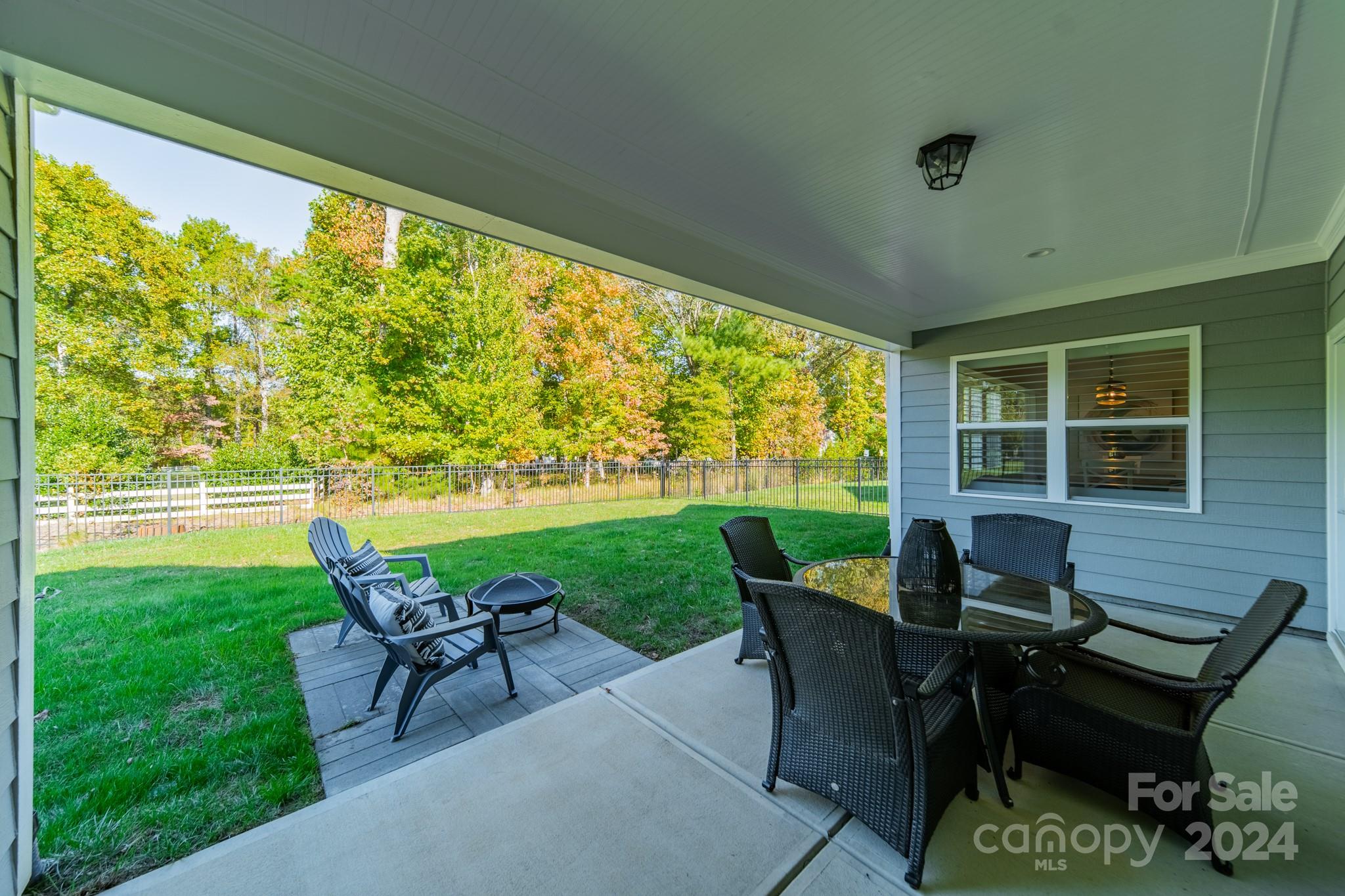 2826 Walker Road Matthews, NC 28105 - Photo 11 of 45 a view of a patio with table and chairs and potted plants