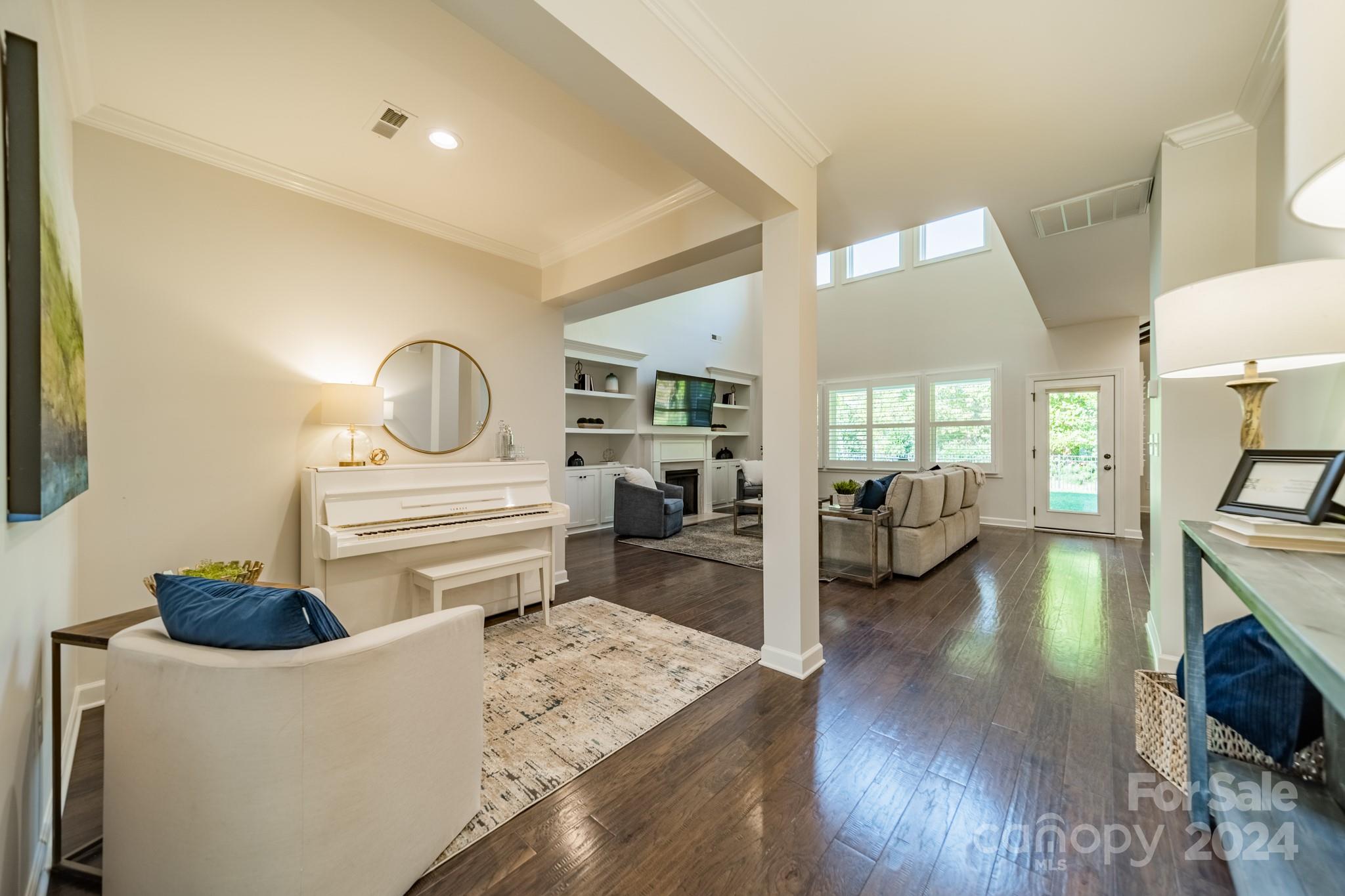 2826 Walker Road Matthews, NC 28105 - Photo 13 of 45 a living room with furniture and a wooden floor