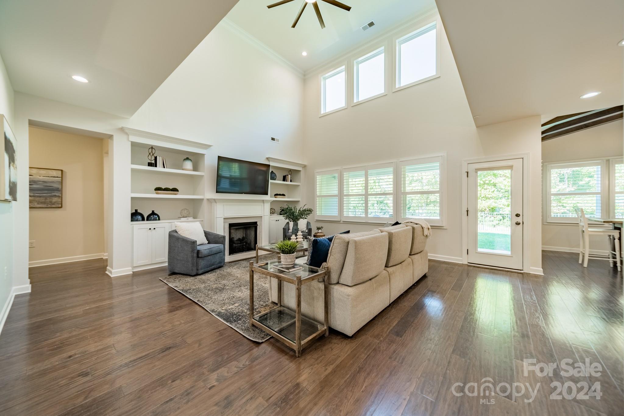 2826 Walker Road Matthews, NC 28105 - Photo 15 of 45 a living room with furniture fireplace and flat screen tv