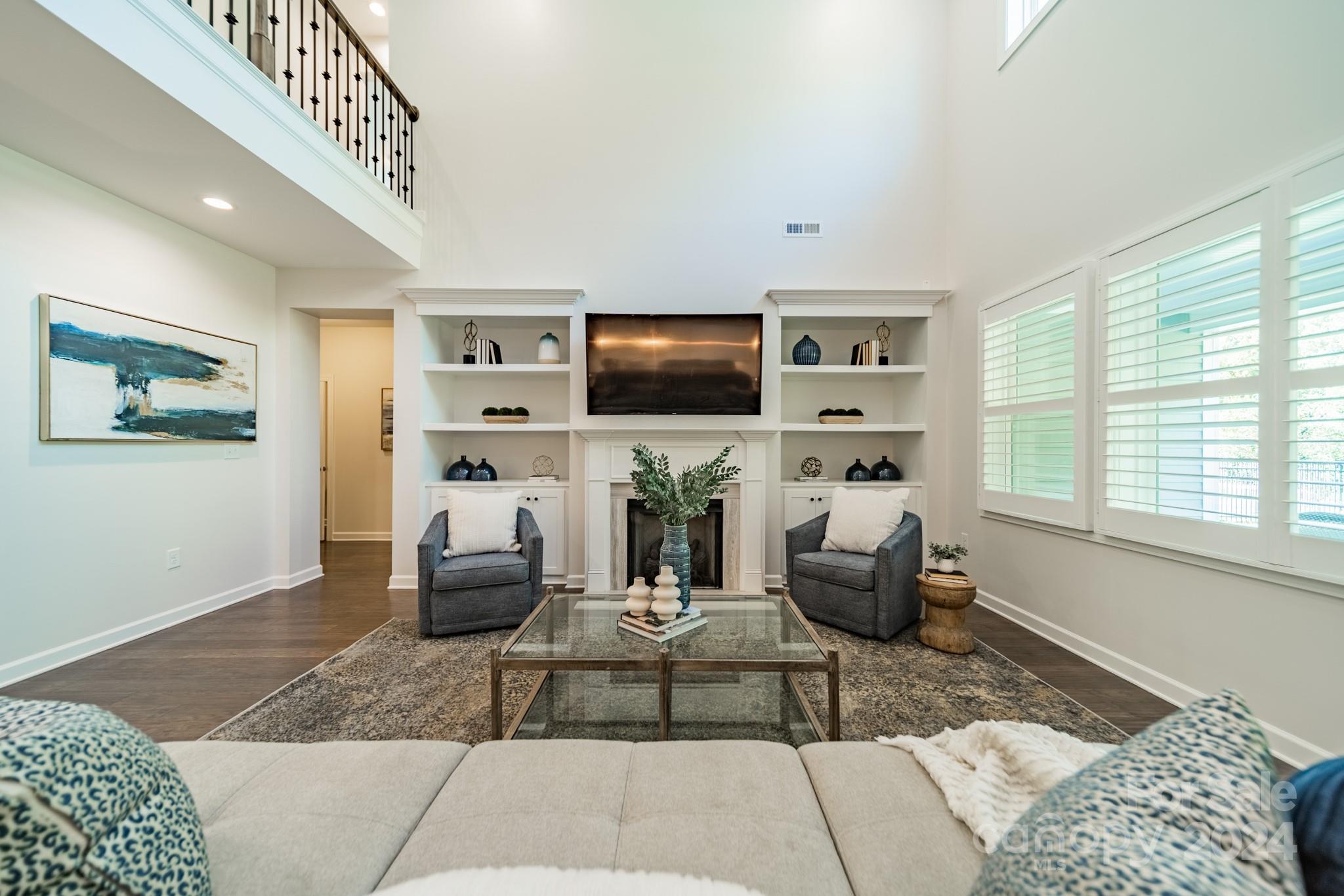 2826 Walker Road Matthews, NC 28105 - Photo 16 of 45 a living room with furniture and a flat screen tv