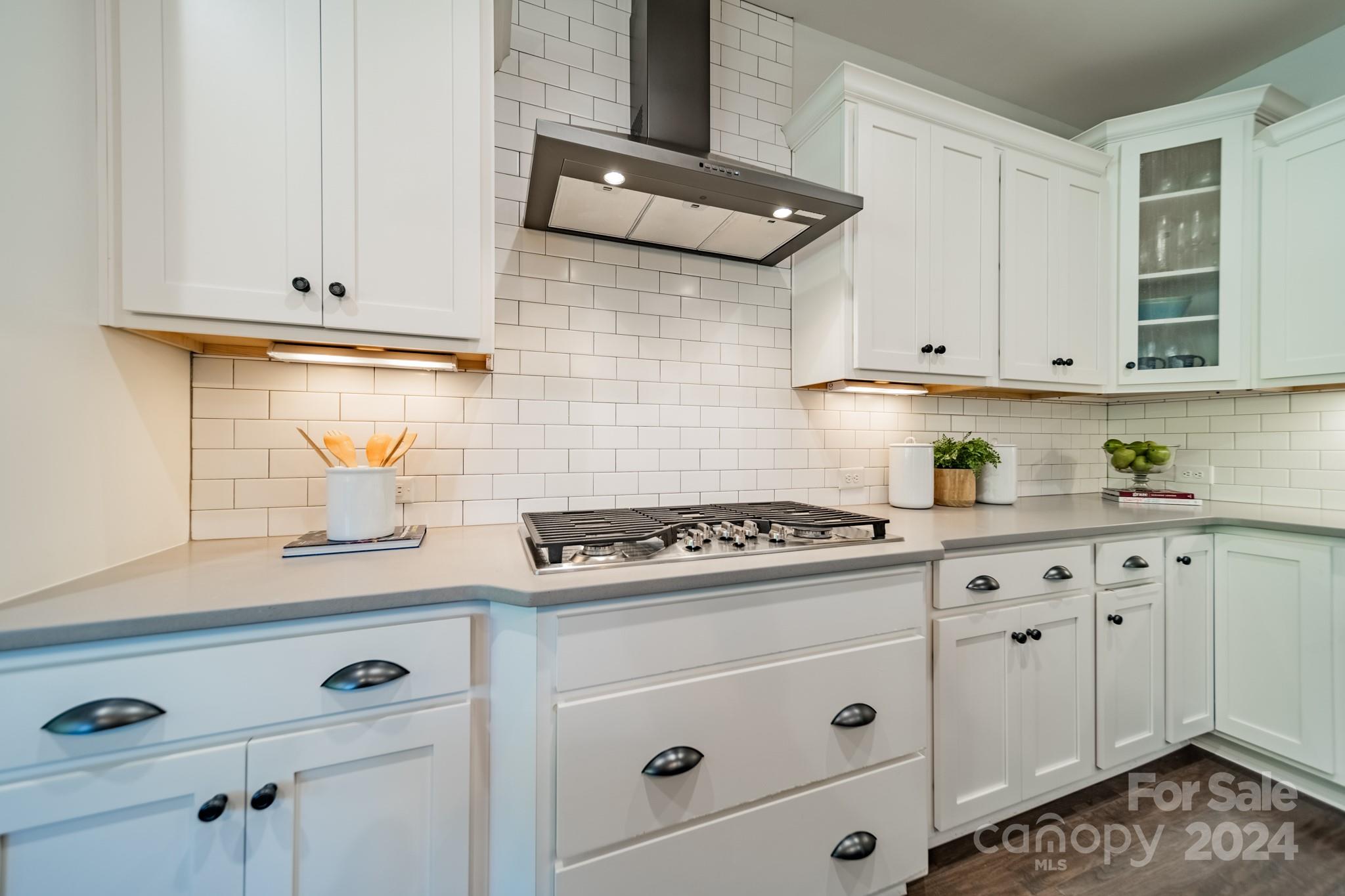 2826 Walker Road Matthews, NC 28105 - Photo 22 of 45 a kitchen with white cabinets and white appliances