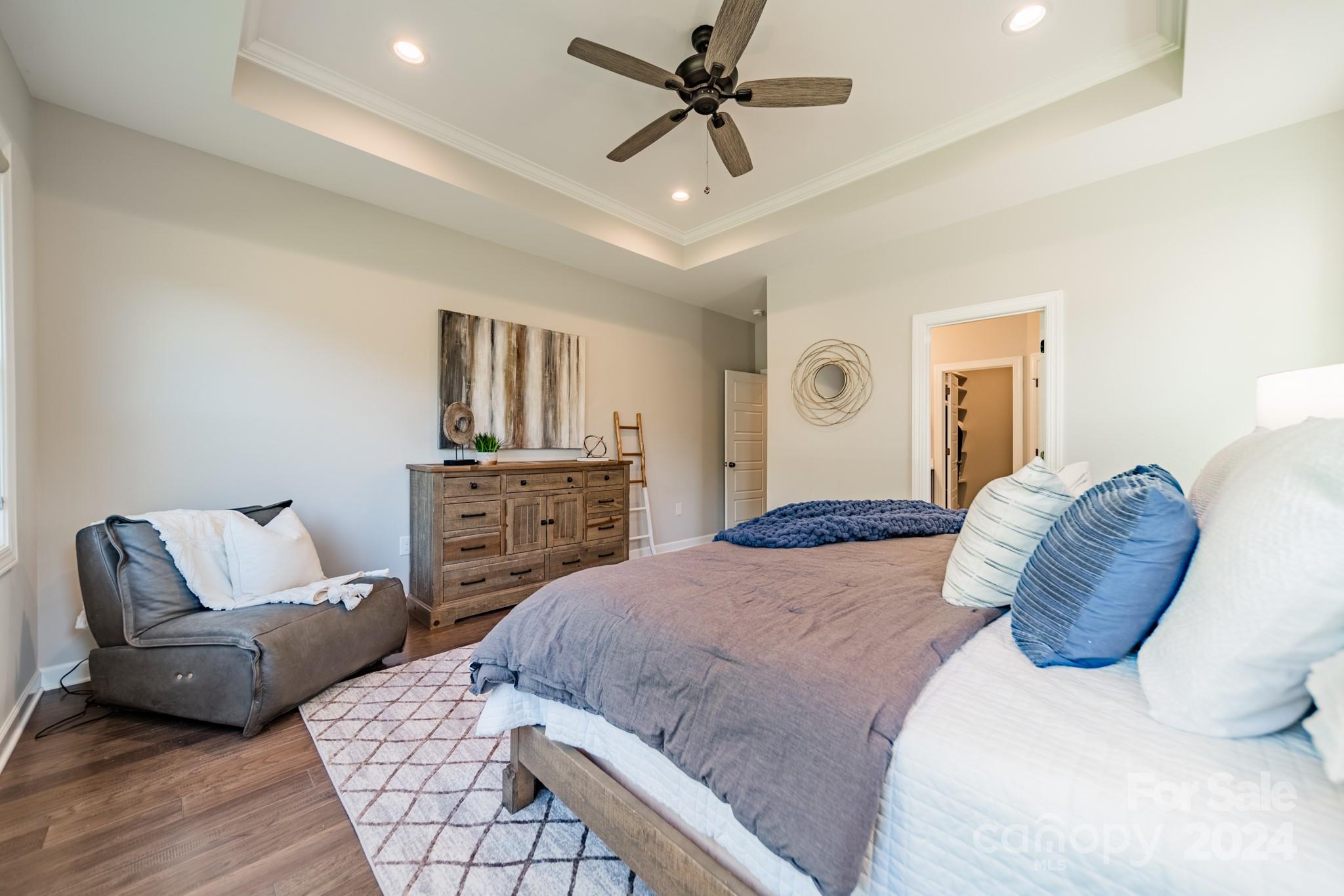 2826 Walker Road Matthews, NC 28105 - Photo 29 of 45 a bedroom with a large bed and a couch