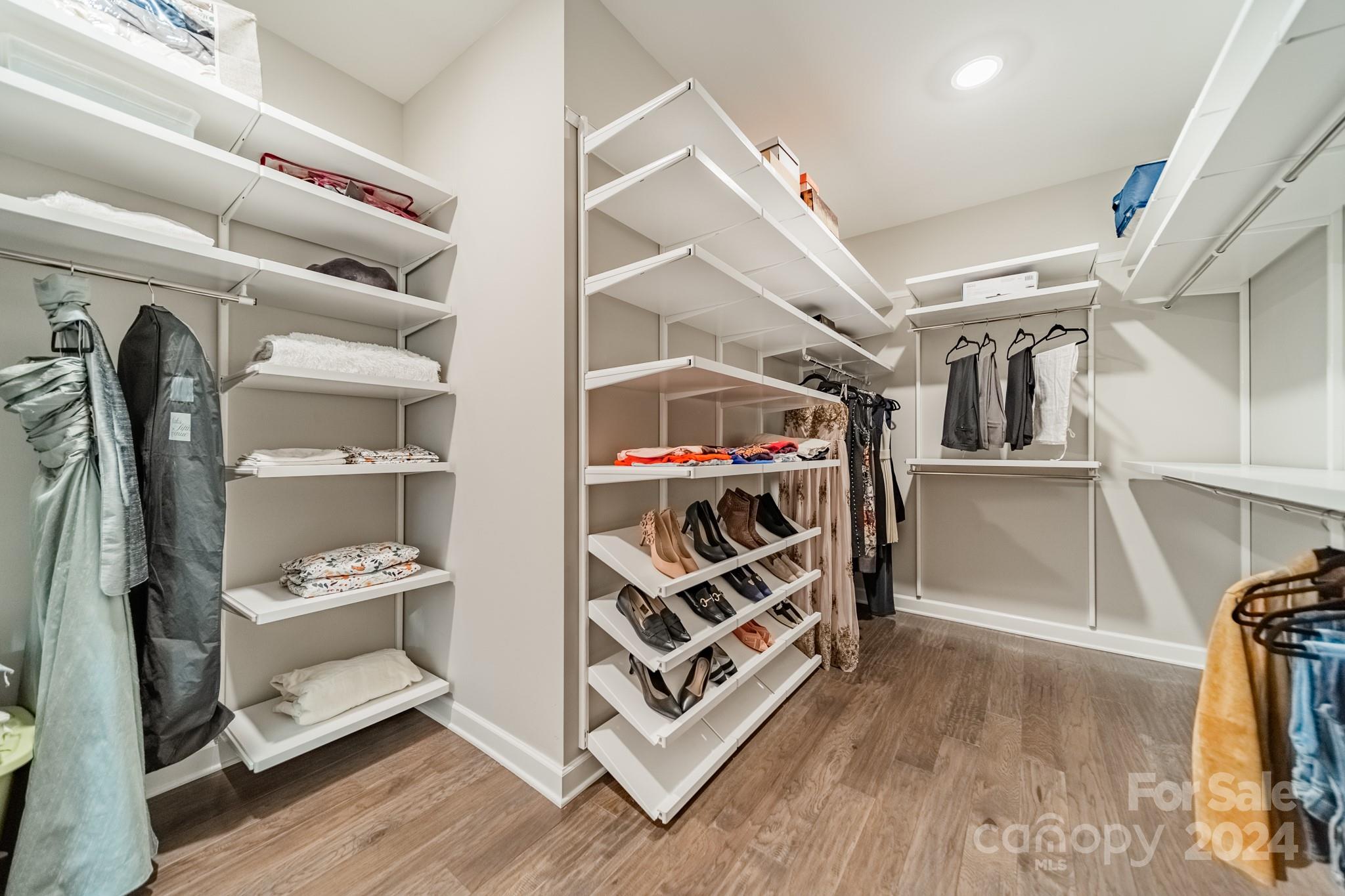 2826 Walker Road Matthews, NC 28105 - Photo 33 of 45 a walk in closet with wooden floor
