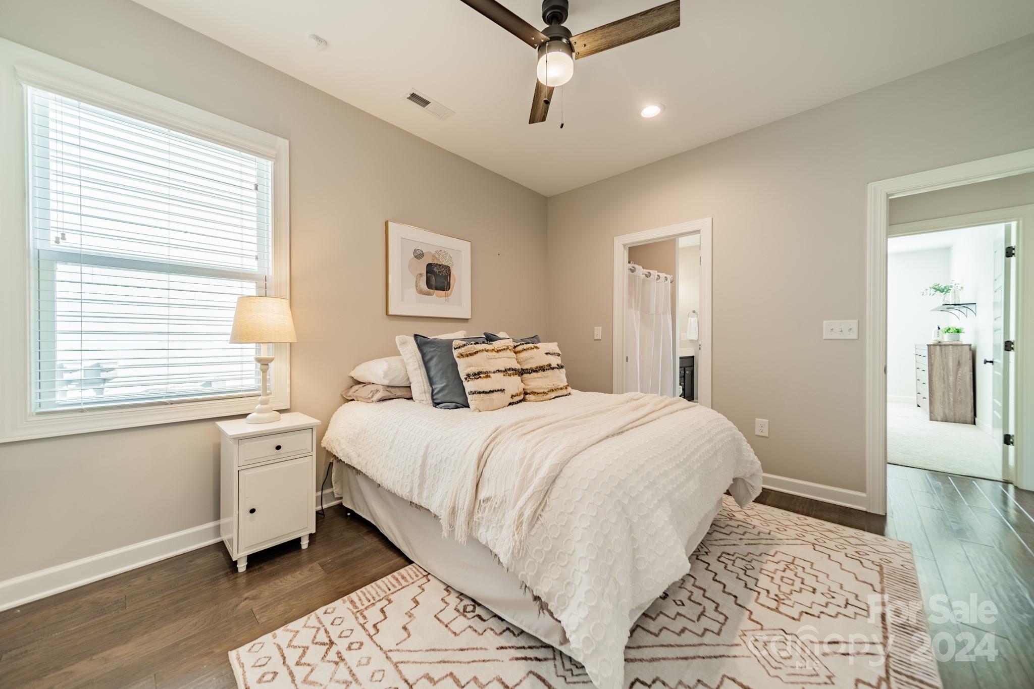 2826 Walker Road Matthews, NC 28105 - Photo 36 of 45 a spacious bedroom with a large bed and a window