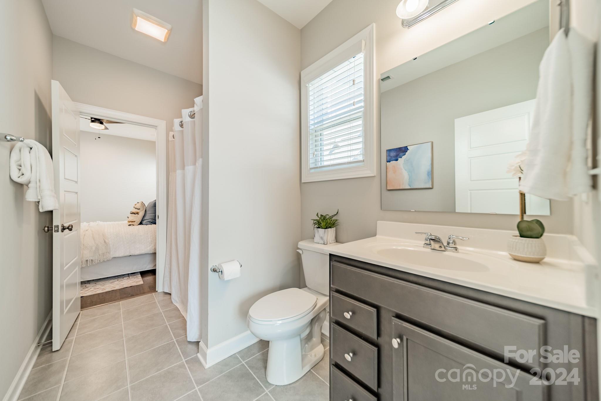 2826 Walker Road Matthews, NC 28105 - Photo 38 of 45 a bathroom with a sink toilet and shower