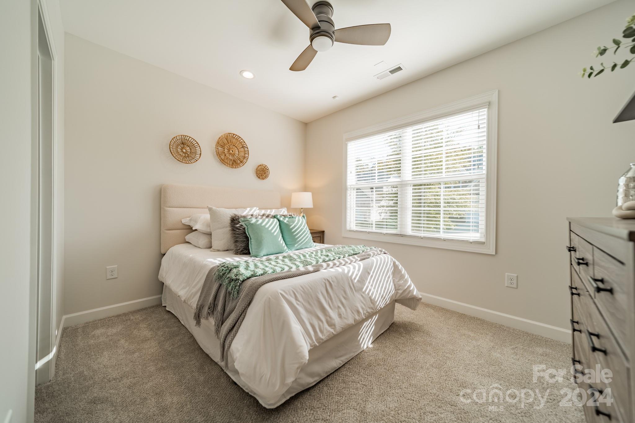 2826 Walker Road Matthews, NC 28105 - Photo 39 of 45 a bedroom with a bed and window