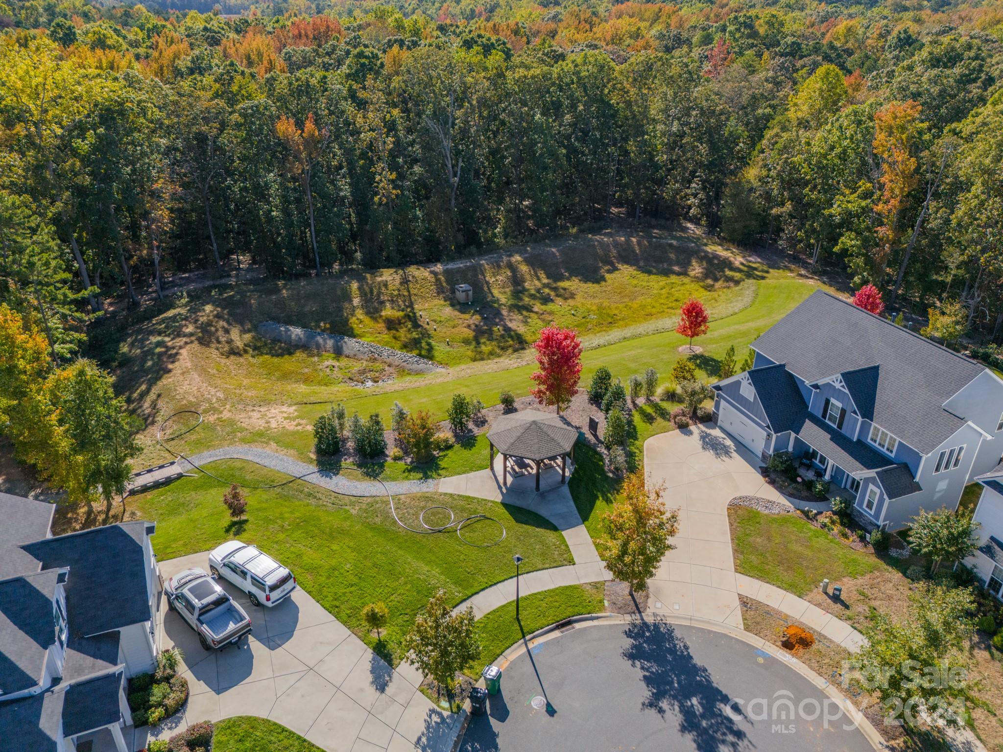 2826 Walker Road Matthews, NC 28105 - Photo 4 of 45 an aerial view of a house with yard swimming pool and outdoor seating