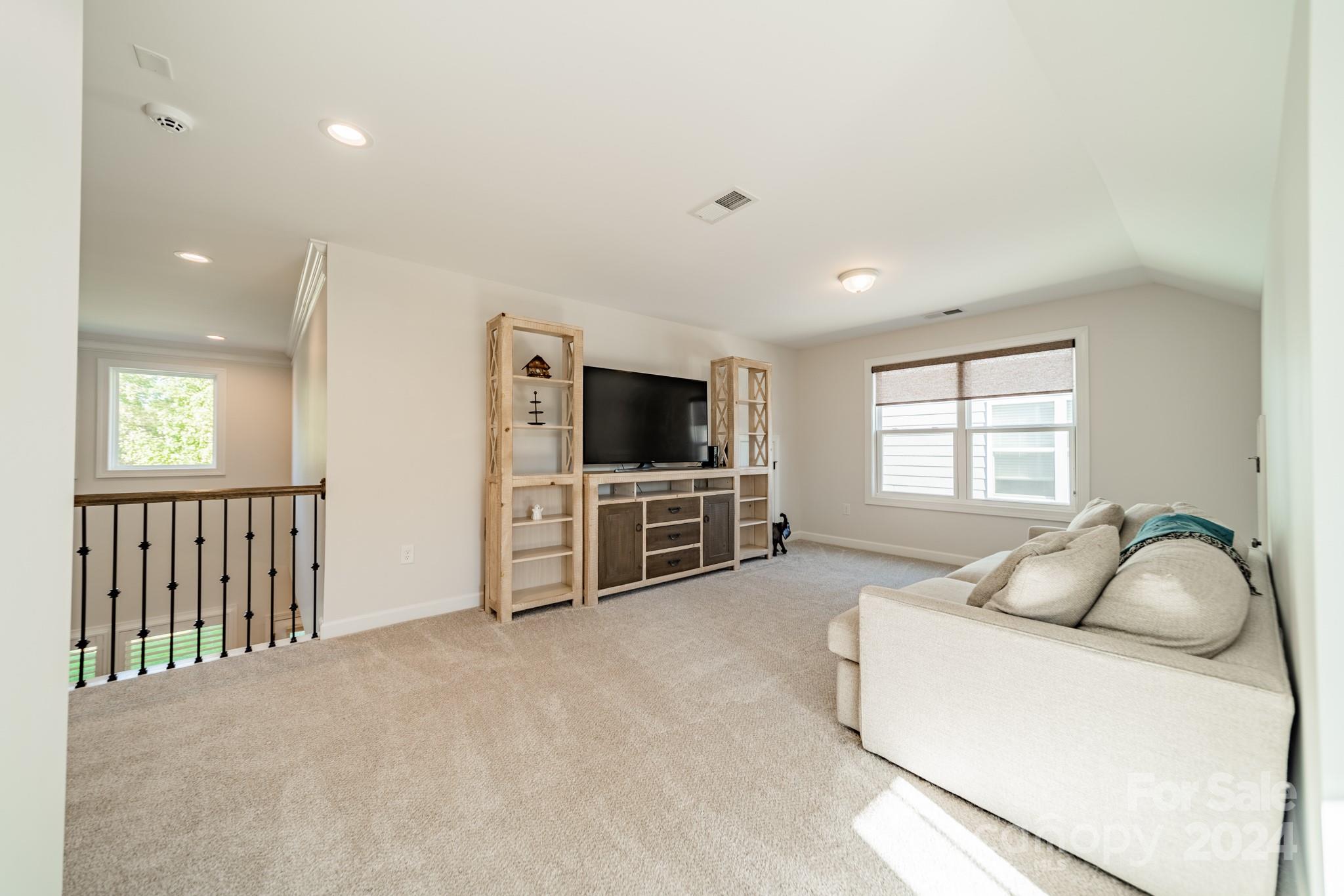 2826 Walker Road Matthews, NC 28105 - Photo 41 of 45 a living room with furniture and a flat screen tv