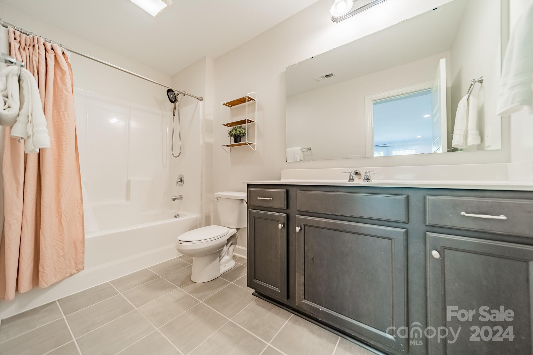 2826 Walker Road Matthews, NC 28105 - Photo 44 of 45 a bathroom with a sink toilet and shower