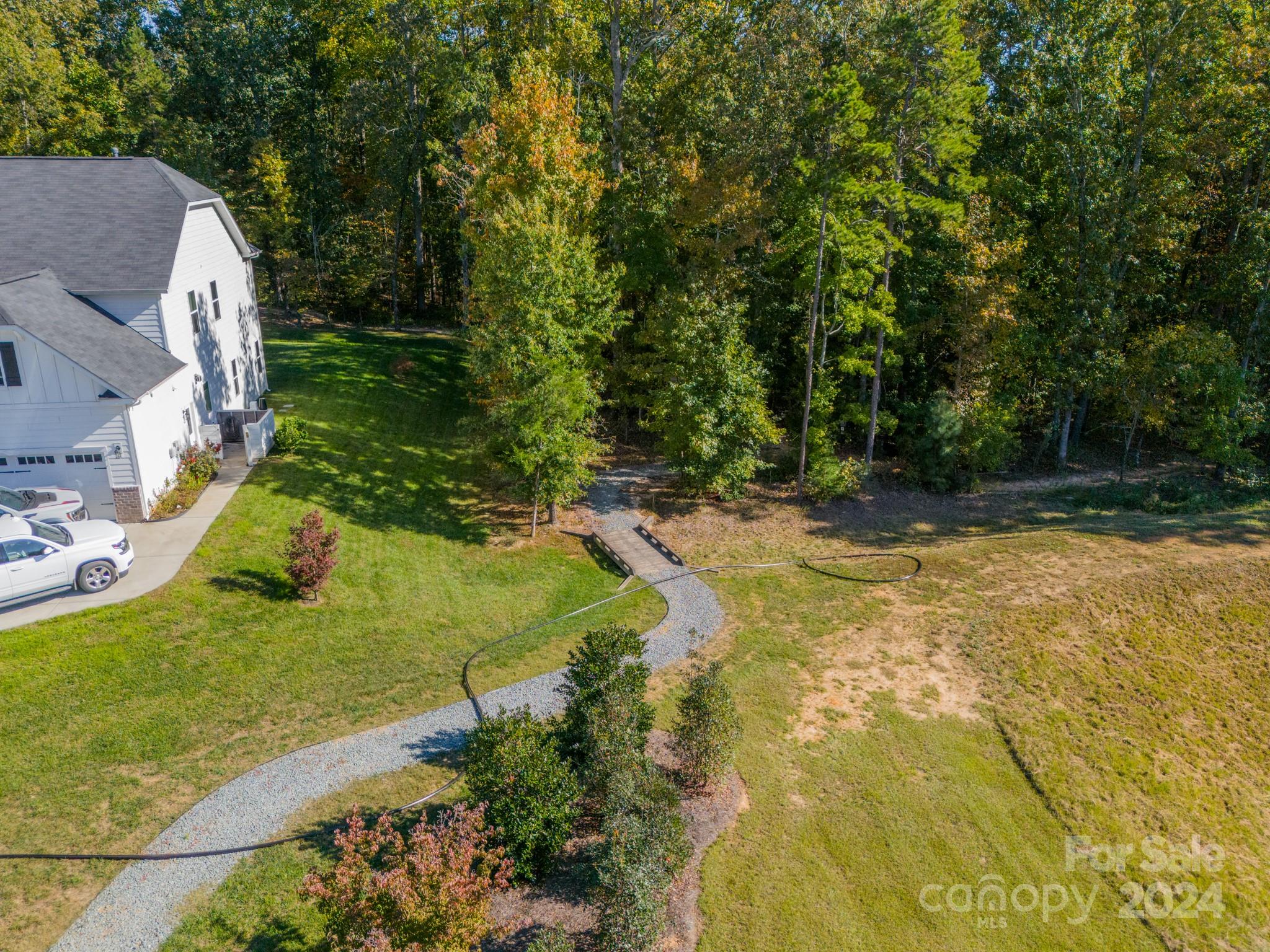 2826 Walker Road Matthews, NC 28105 - Photo 5 of 45 a view of a yard with swimming pool