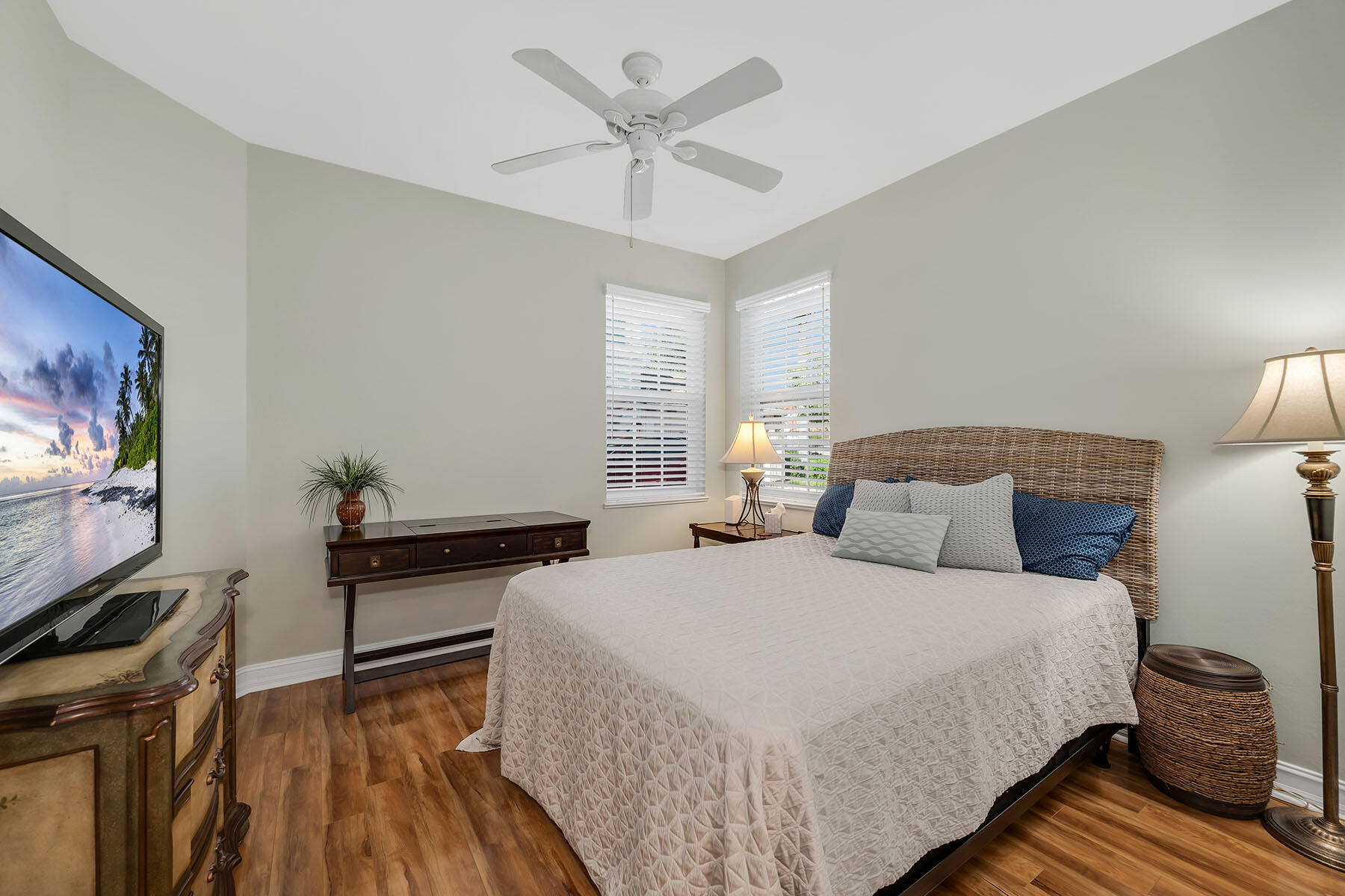 1285 Rialto Way, Unit 102 Naples, FL 34114 - Photo 21 of 49 a bedroom with a bed and a flat screen tv