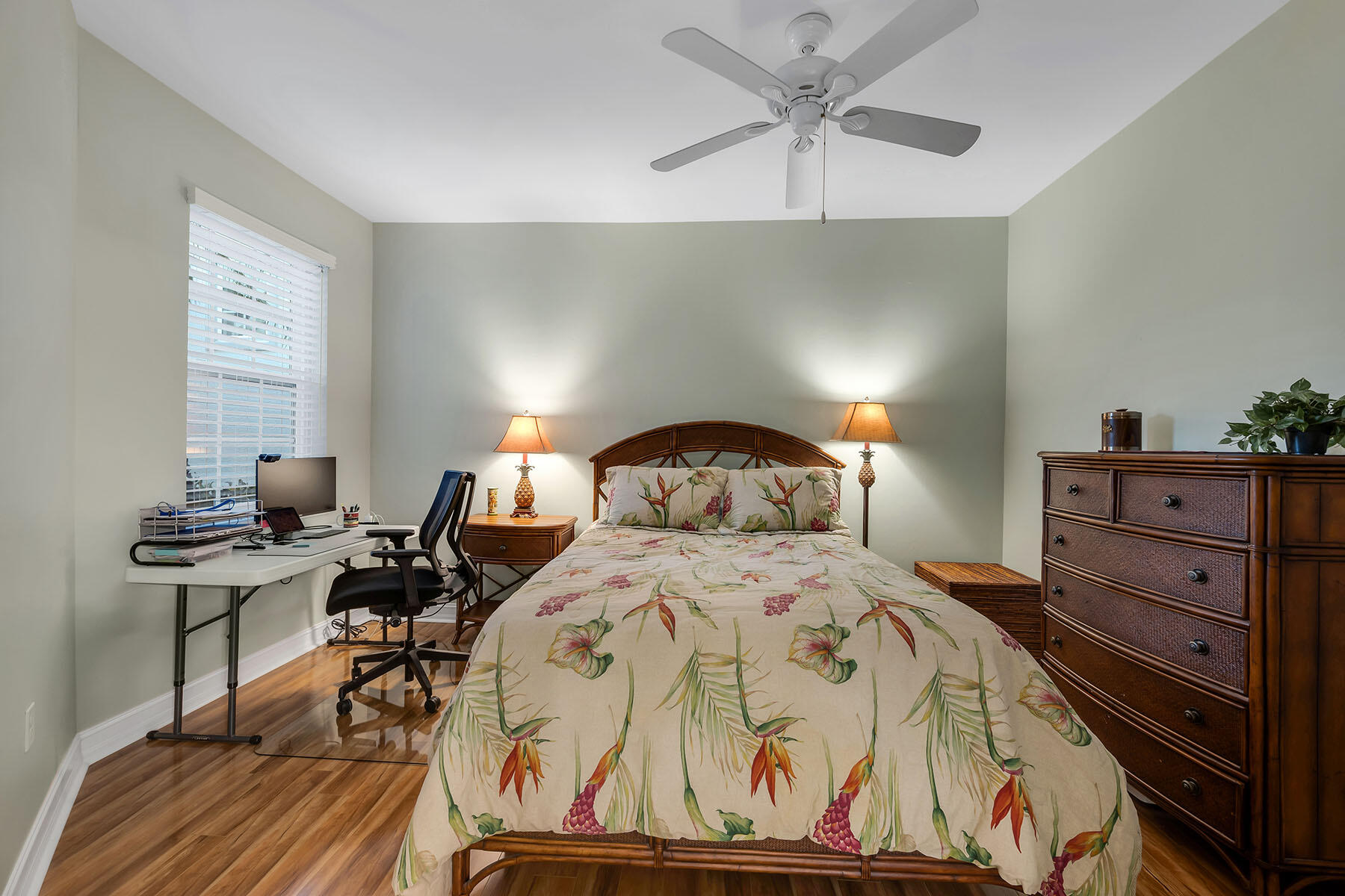 1285 Rialto Way, Unit 102 Naples, FL 34114 - Photo 24 of 49 a bedroom with a bed and a chandelier