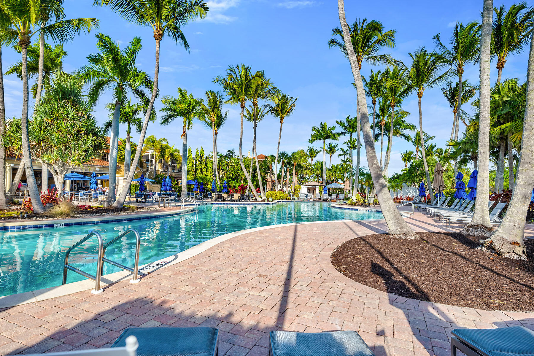 1285 Rialto Way, Unit 102 Naples, FL 34114 - Photo 32 of 49 a view of a yard with a patio