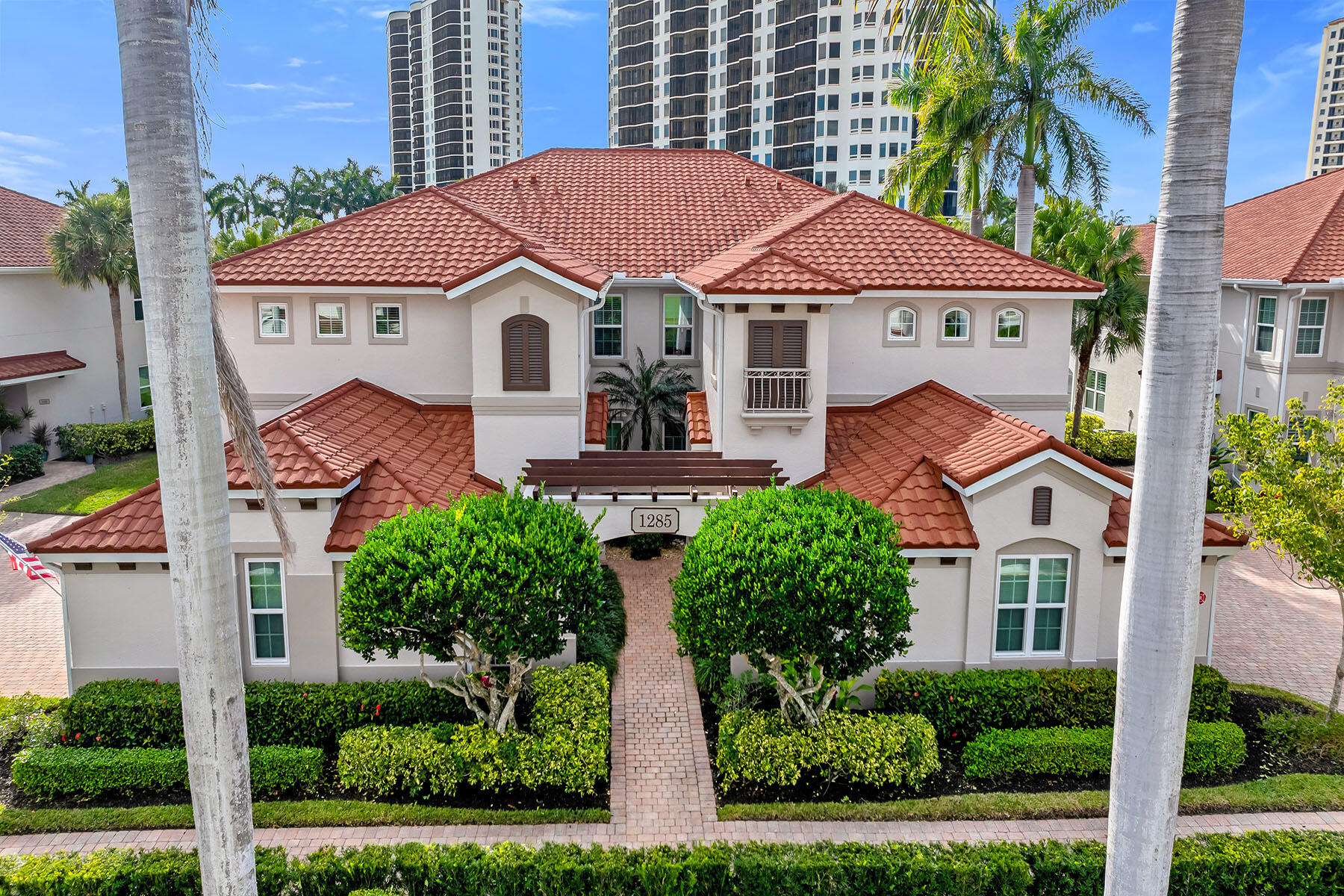 1285 Rialto Way, Unit 102 Naples, FL 34114 - Photo 39 of 49 front view of a house with a yard