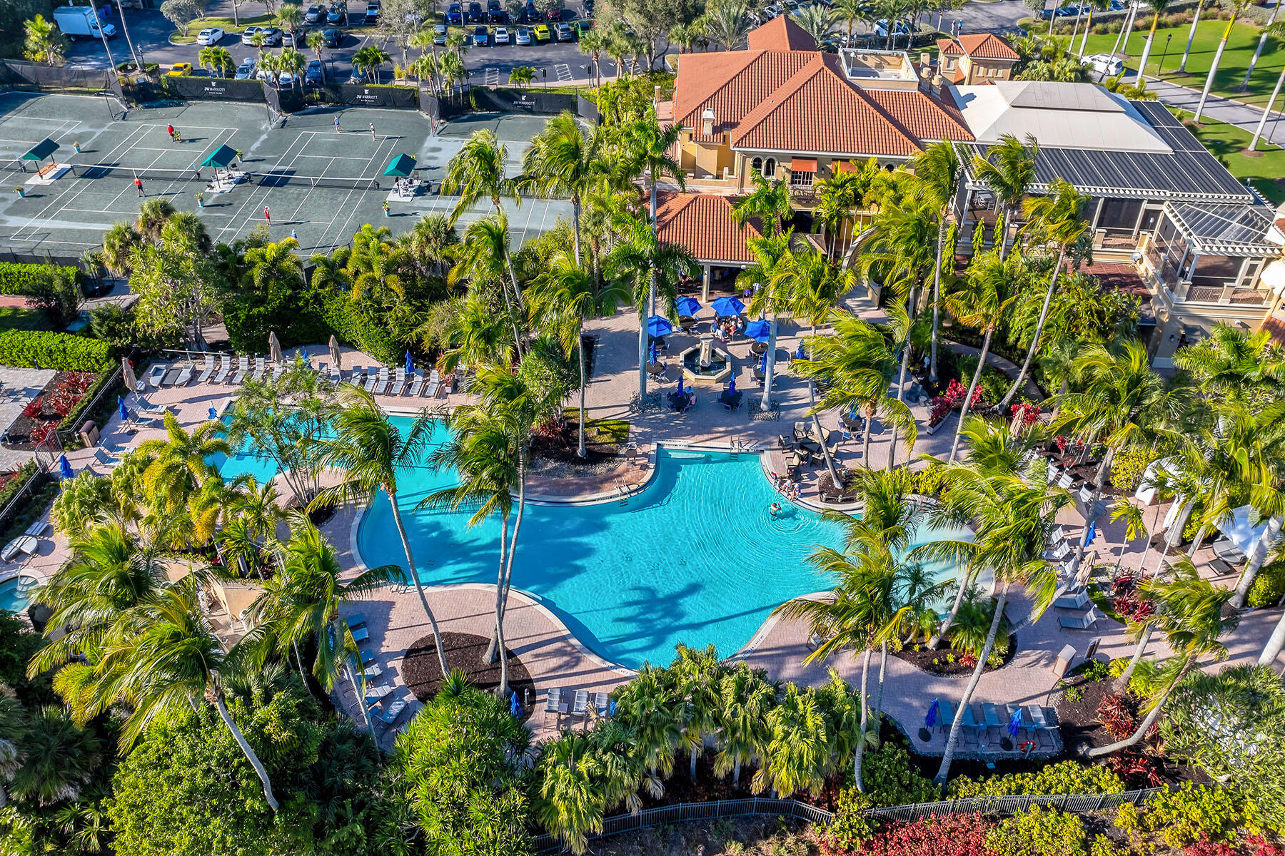 1285 Rialto Way, Unit 102 Naples, FL 34114 - Photo 48 of 49 a view of a garden with plants and a fountain