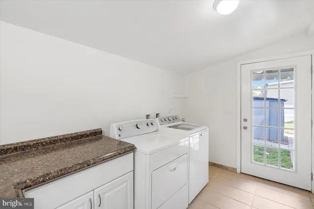 a utility room with washer and dryer
