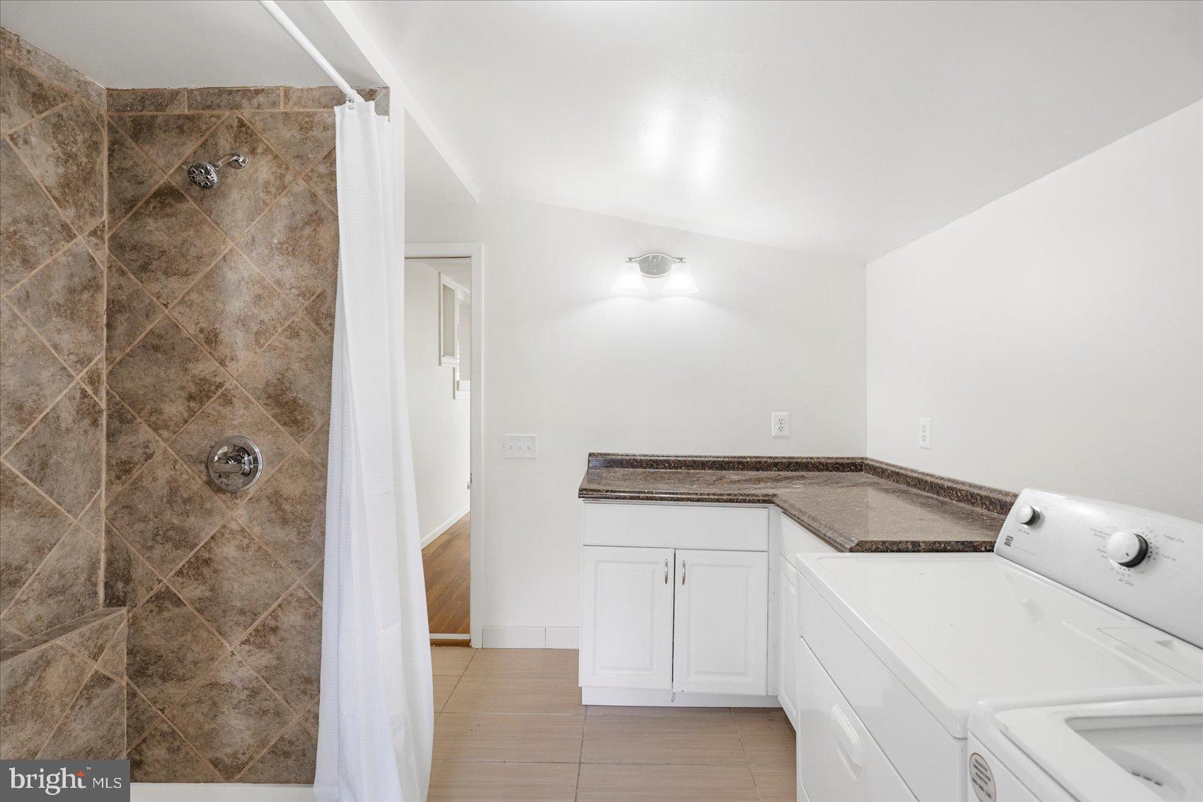 103 Conestoga Road Middle River, MD 21220 - Photo 12 of 27 Bright and functional laundry space with shower.