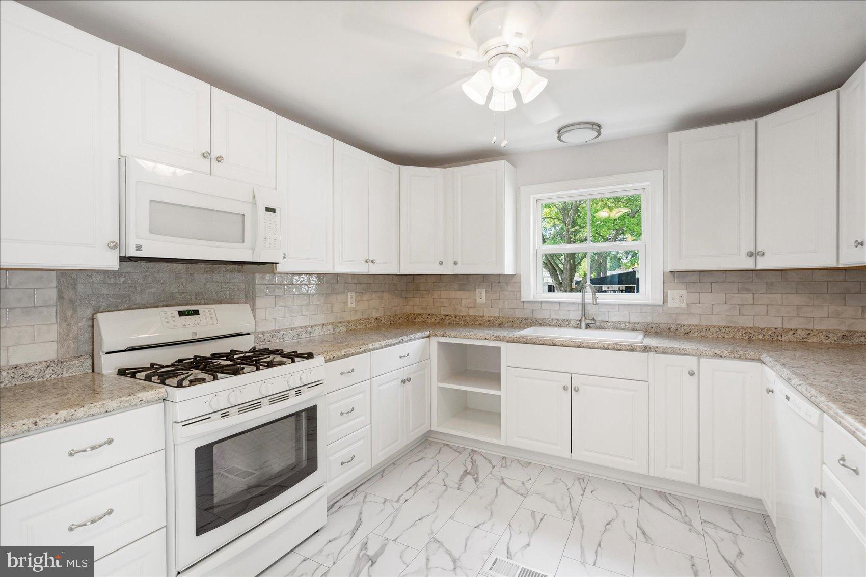 103 Conestoga Road Middle River, MD 21220 - Photo 13 of 27 Bright and airy modern kitchen design.