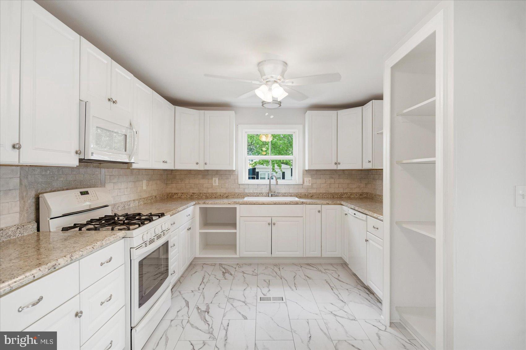103 Conestoga Road Middle River, MD 21220 - Photo 2 of 27 Bright and airy kitchen with modern finishes.