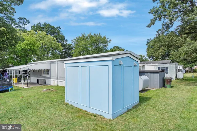 a view of a backyard with a small cabin