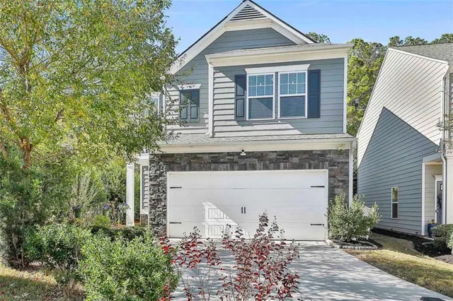 front view of a house with a yard