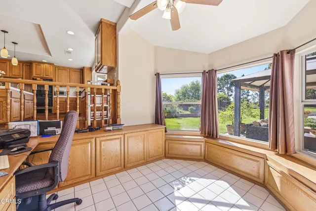 a view of a large kitchen with swimming pool and furniture