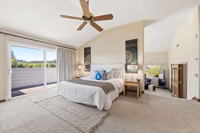 a bed room with bed and a window