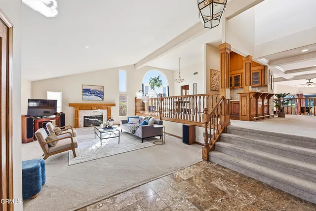 a living room with furniture or couch and a table