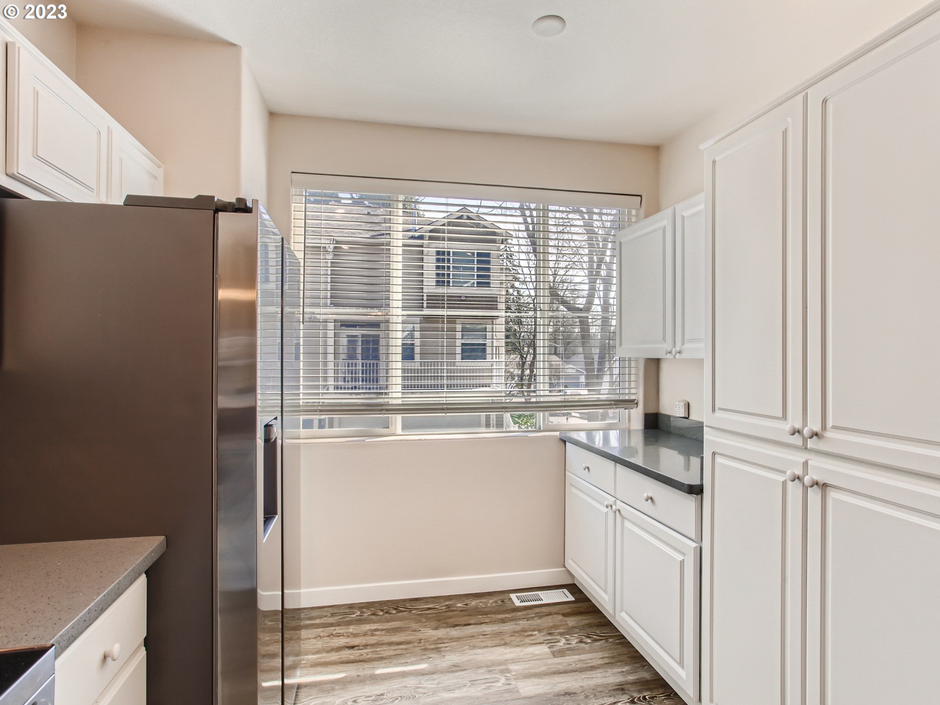 14140 Southwest Barrows Road, Unit 2 Portland, OR 97223 - Photo 12 of 30 a kitchen with a sink and a refrigerator