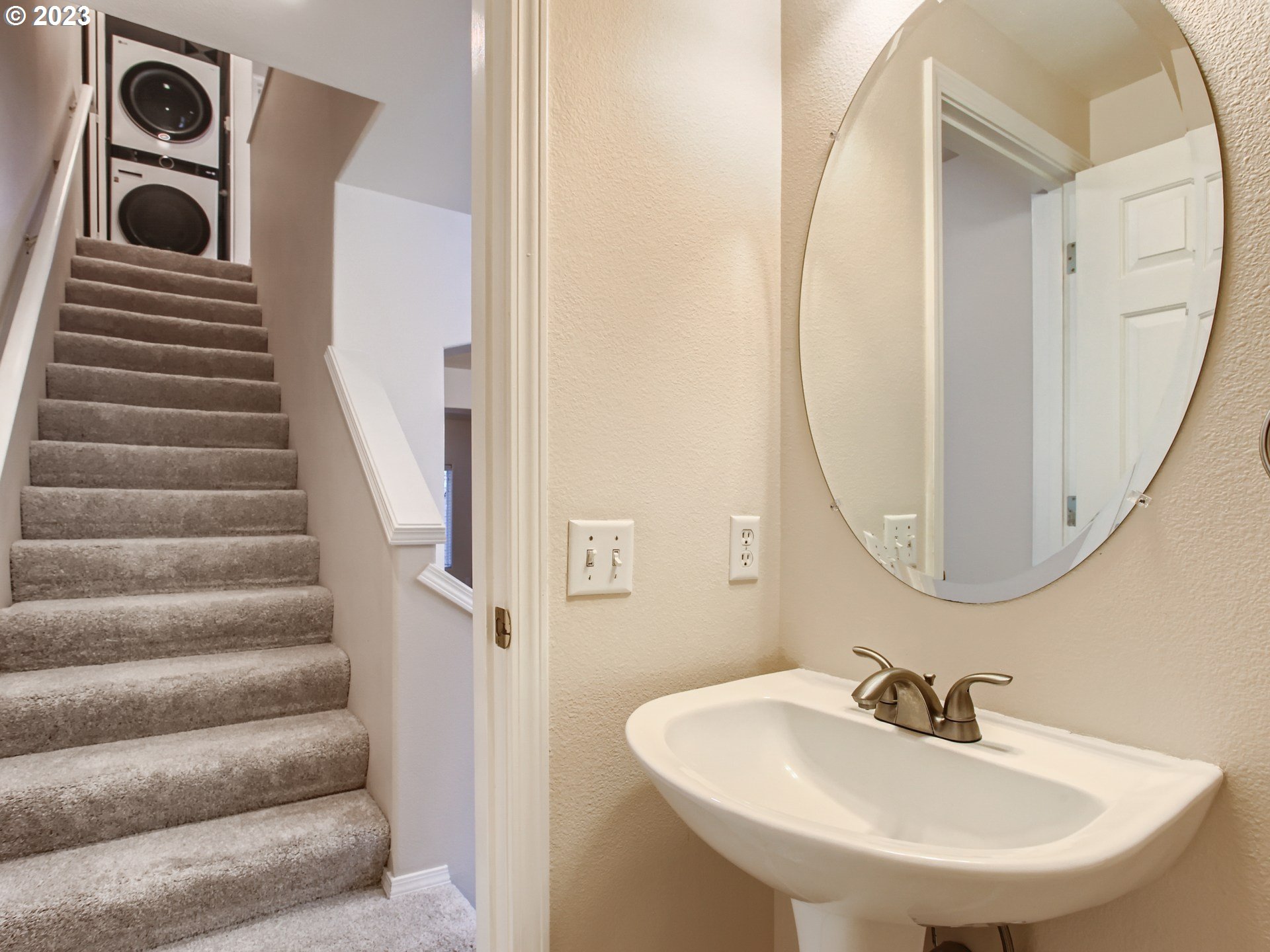 14140 Southwest Barrows Road, Unit 2 Portland, OR 97223 - Photo 13 of 30 a bathroom with a sink and a mirror