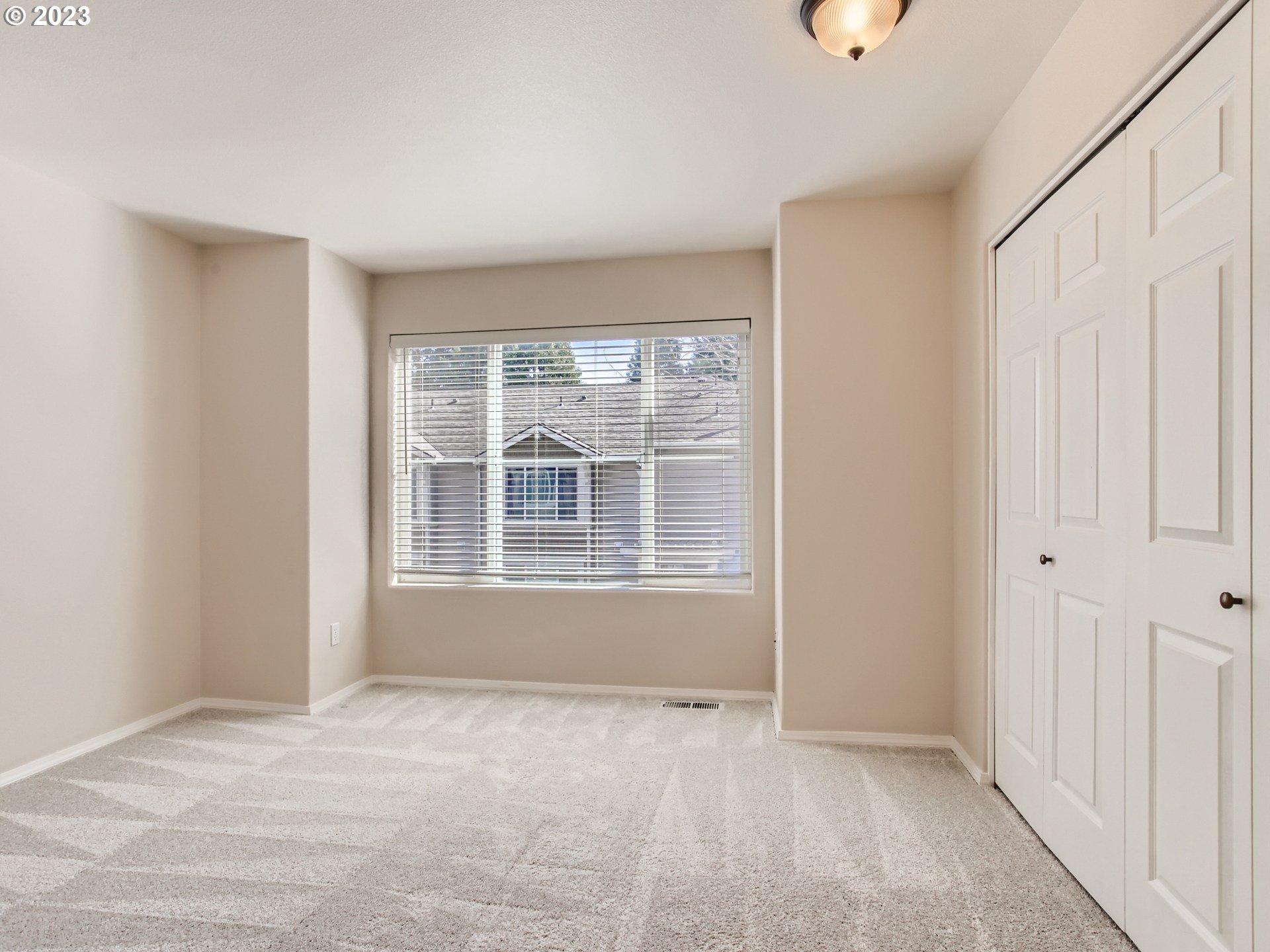 14140 Southwest Barrows Road, Unit 2 Portland, OR 97223 - Photo 14 of 30 a view of an empty room with a window