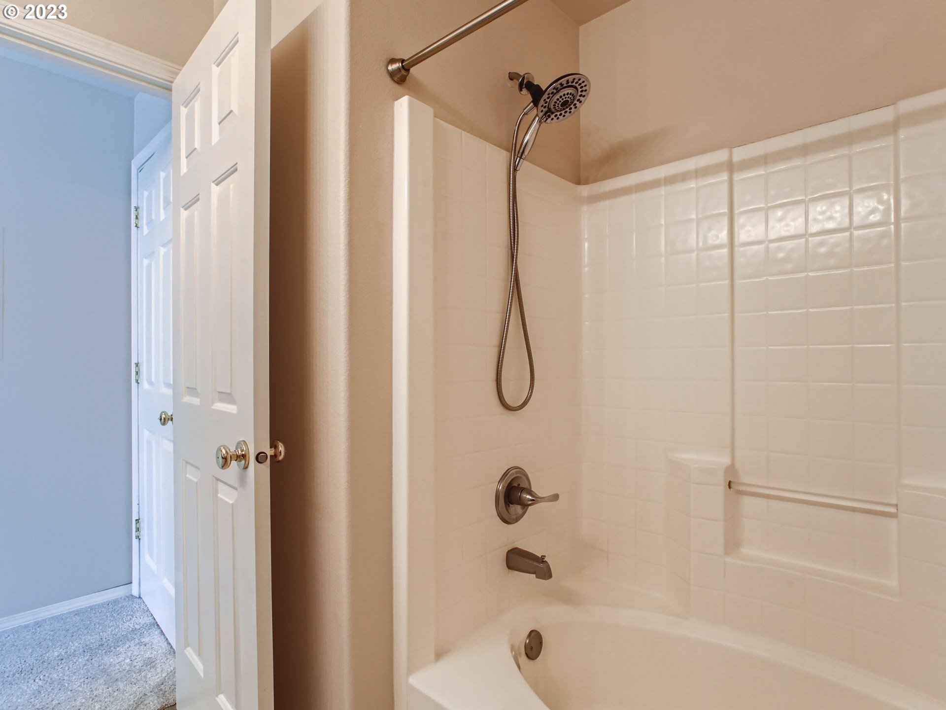 14140 Southwest Barrows Road, Unit 2 Portland, OR 97223 - Photo 18 of 30 a bathroom with a shower and a bath tub